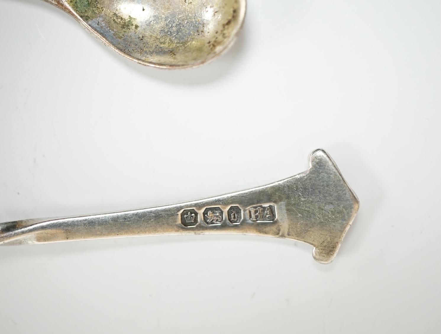 A group of assorted silver including a George III Irish silver basing spoon, Dublin, 1804, 29.5cm, a similar sauce ladle, two Georgian berry spoons, a late Victorian heart shaped photograph frame, a heart shaped pill box